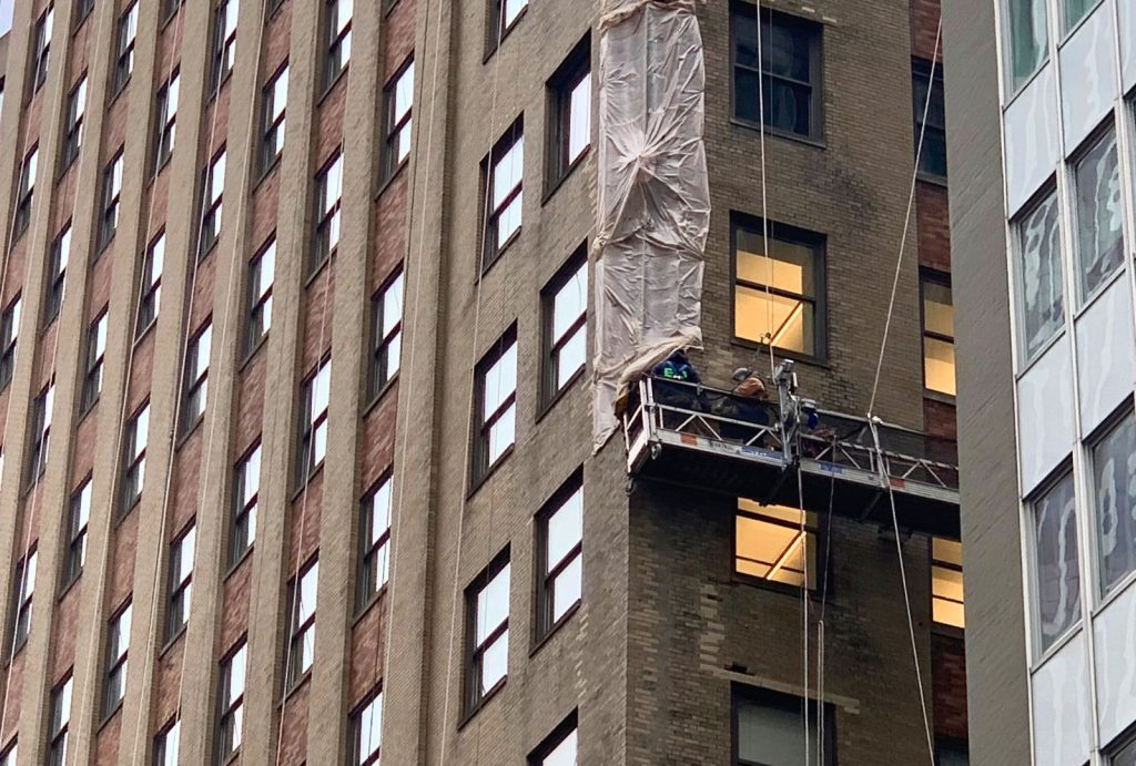 Window cleaners on a building in New York City