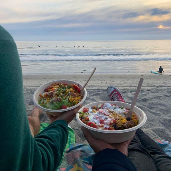 watching surfers and the sunset on the San Diego beach