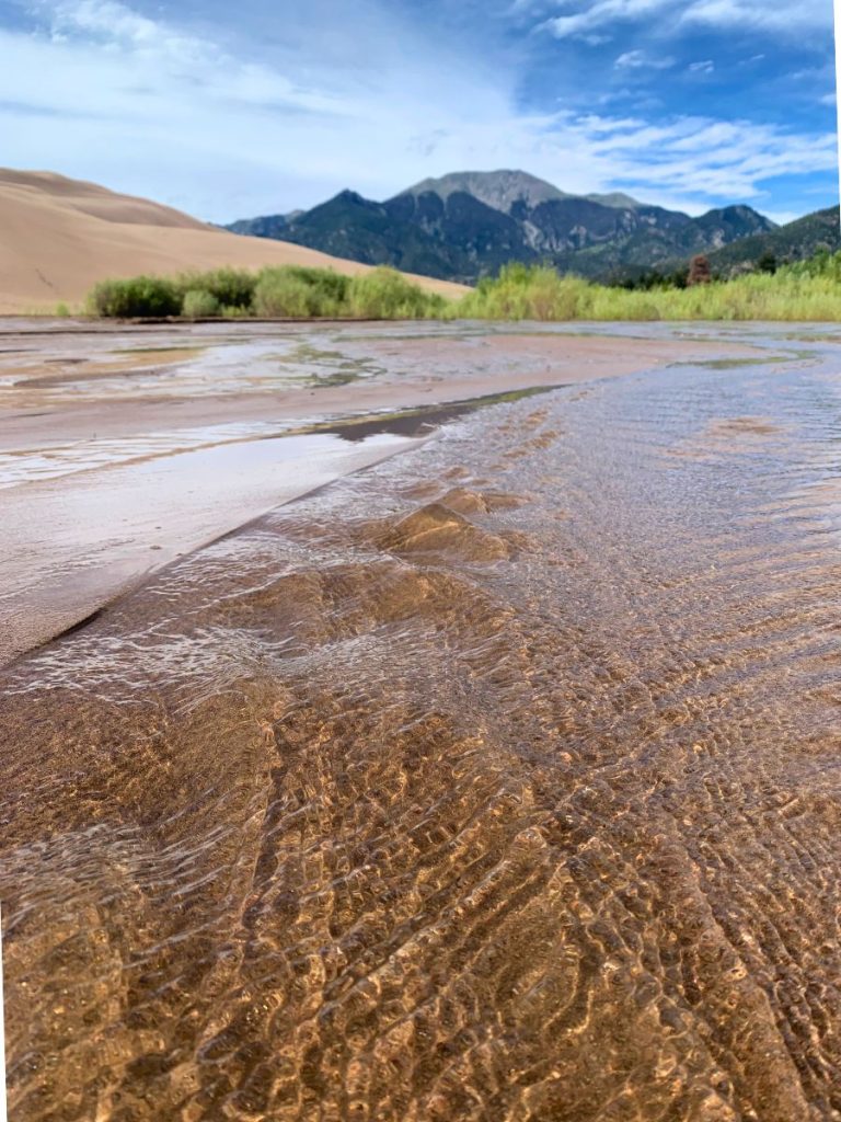 Crossing Medano Creek in Great Sand Dunes National Park