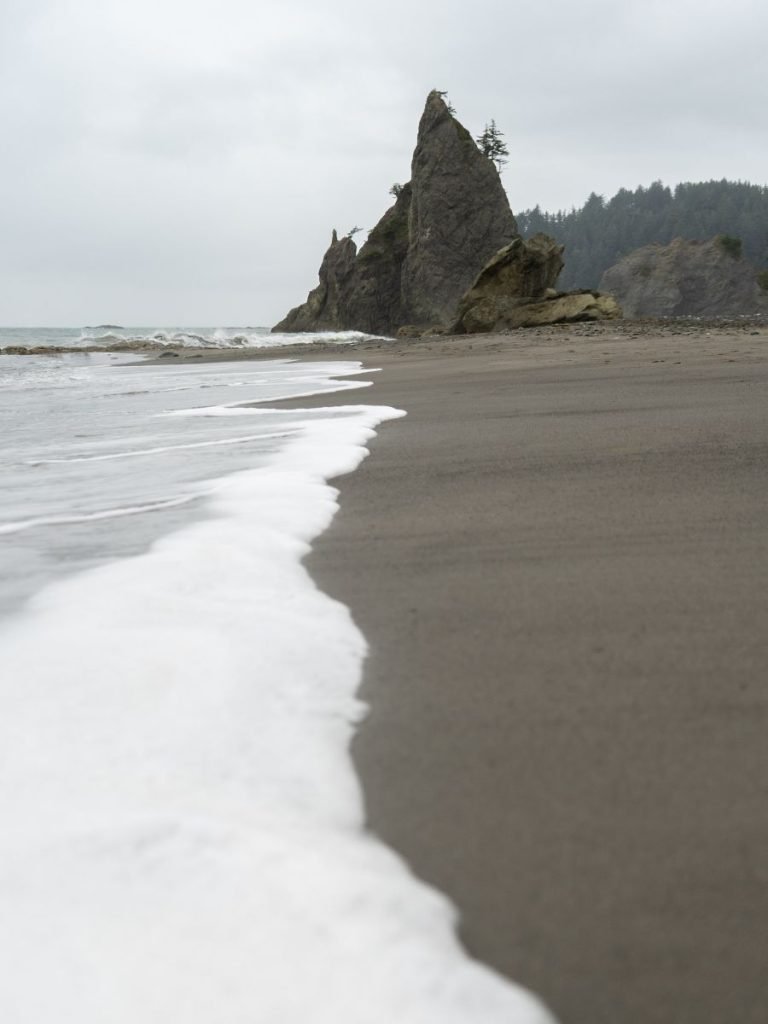 Eerie sea stack in the ocean on washington coast